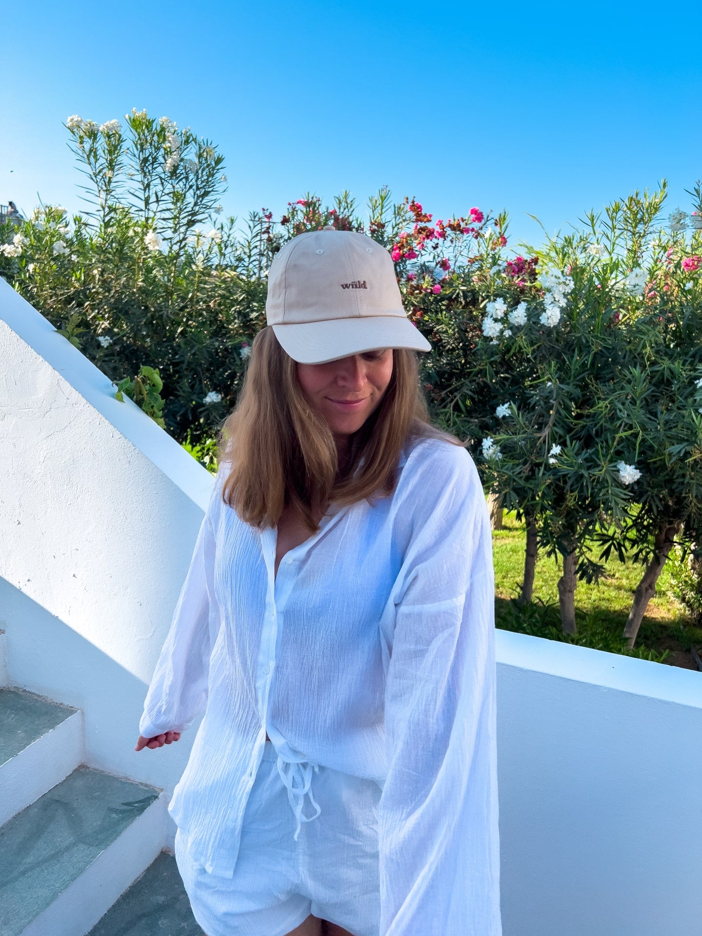Wiild Swimwear Mahua Cap in beige color viewed from the front on model